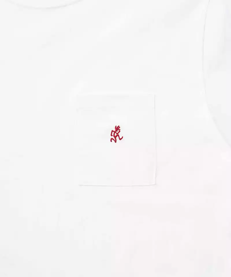 Close-up of a white Gramicci One Point Tee pocket with a running man on a light-tone background.