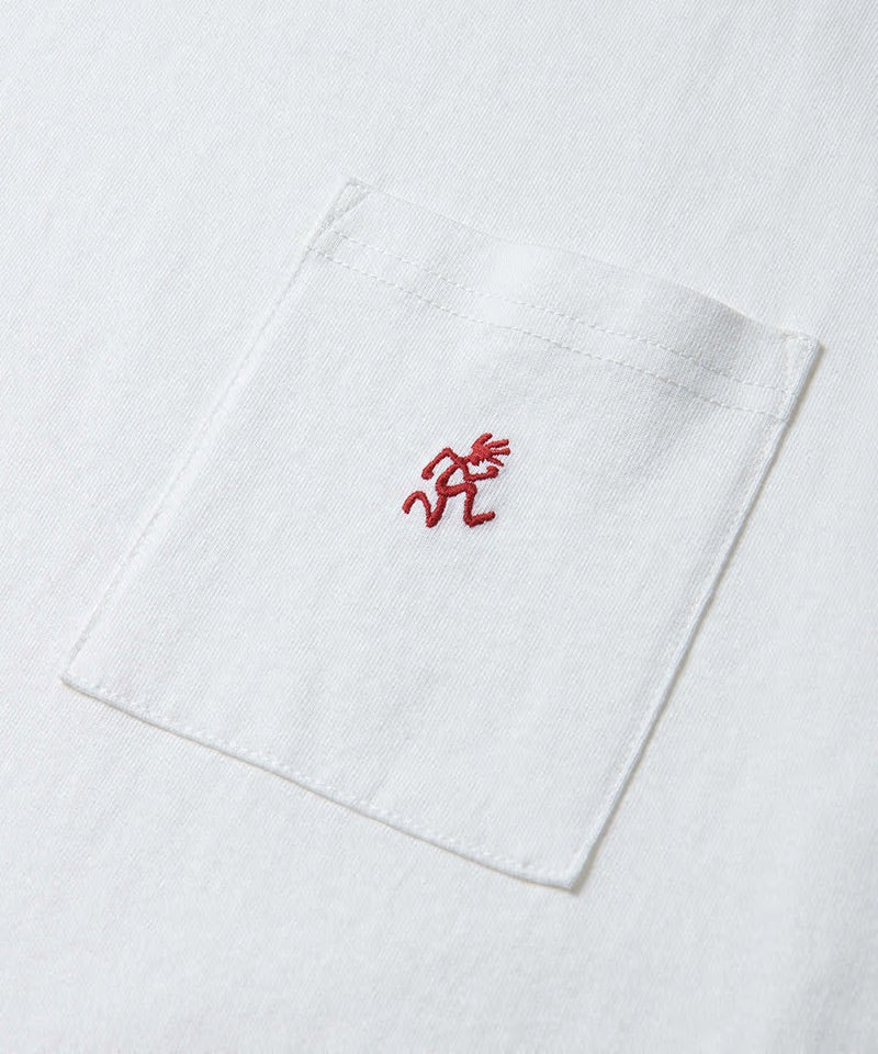 Close-up of a white Gramicci One Point Tee with a running man on the pocket.