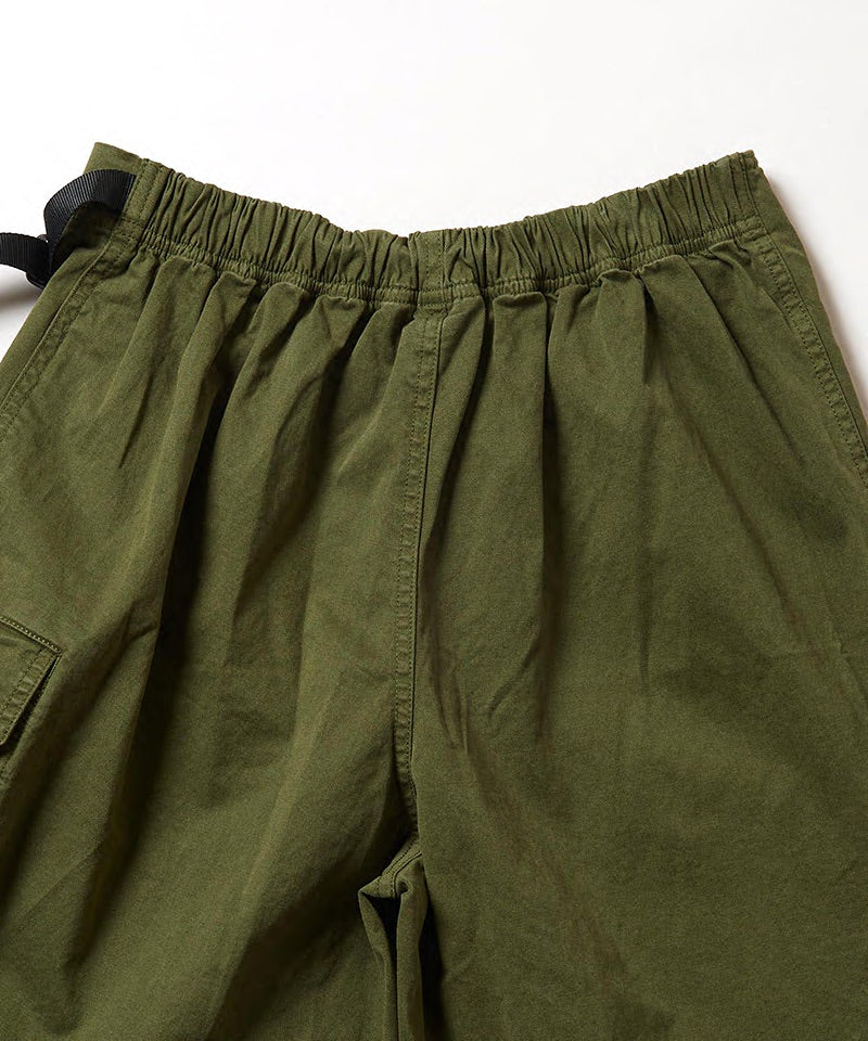 Back view of a Gramicci G-Skort in the color olive on a light-tone background.