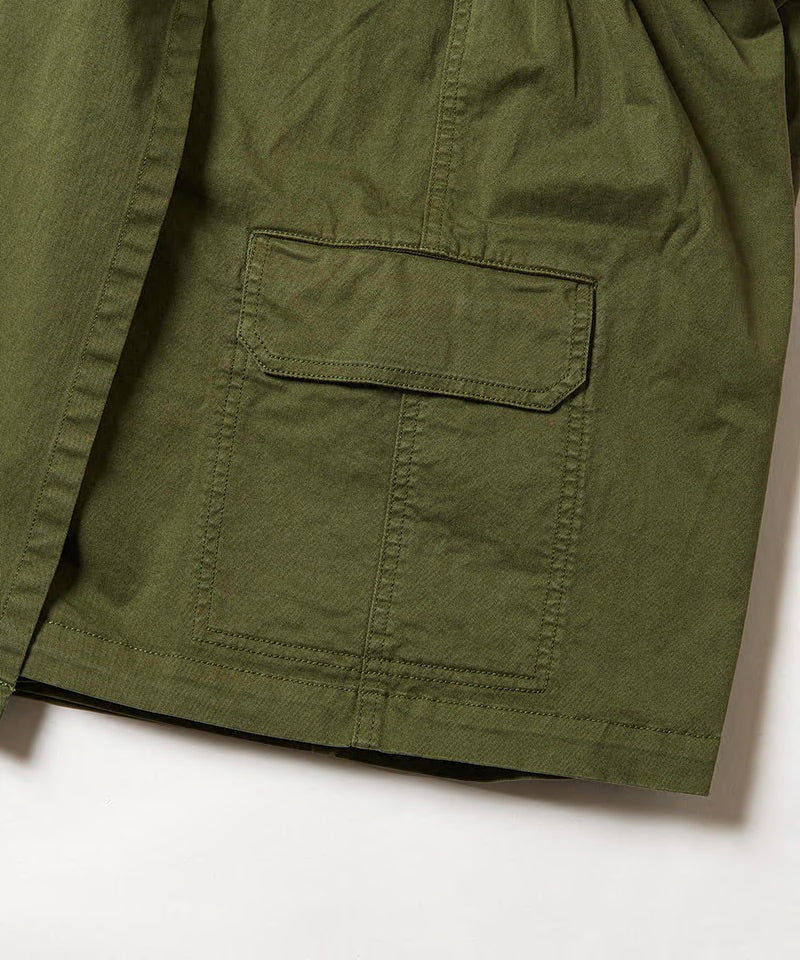 Close-up of Gramicci G-Skort in the color olive against a light-tone background.