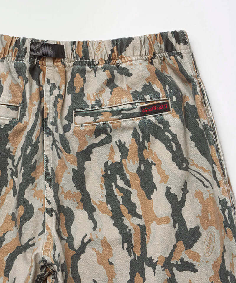 Close-up back view of bark camo Denim Gramicci Pant Straight Fit on a light-tone background.