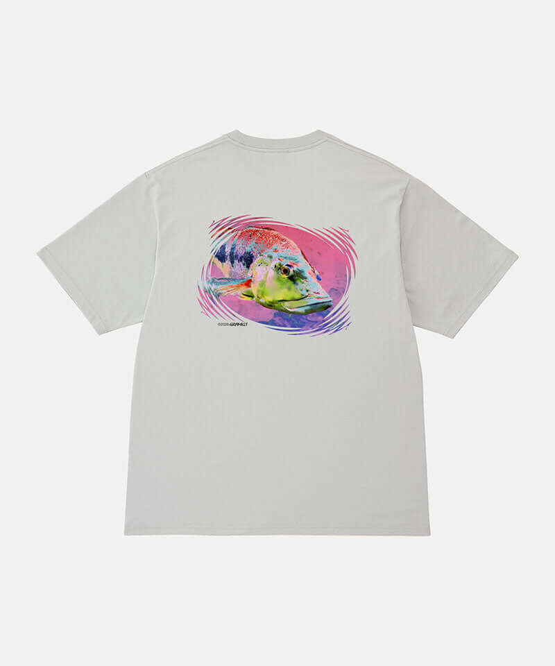 Back view of a Gramicci mist colored Bass Tee with a graphic against a light-tone background.