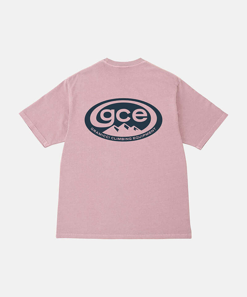 Back view of a Gramicci lilac pigment colored GCE Tee Pigment Dyed with a graphic against a light-tone background.