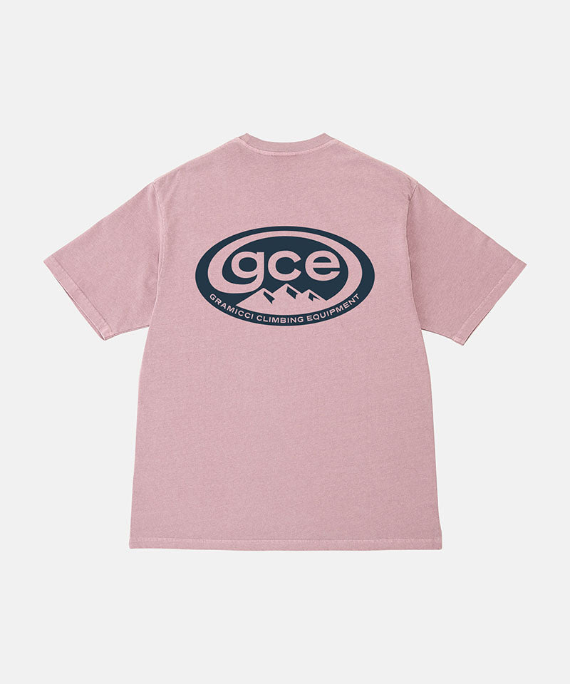 Back view of a Gramicci lilac pigment colored GCE Tee Pigment Dyed with a graphic against a light-tone background.