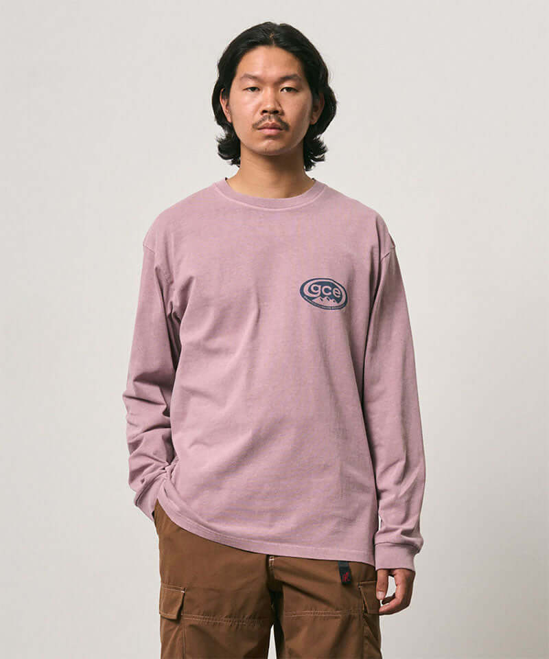 Model wearing a Gramicci lilac pigment GCE Long Sleeve Tee Pigment Dyed against a light-tone background.