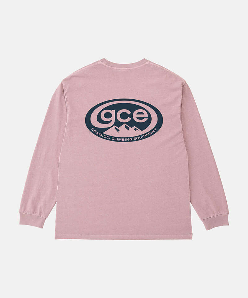 Back view of a Gramicci lilac pigment GCE Long Sleeve Tee Pigment Dyed with a graphic against a light-tone background.