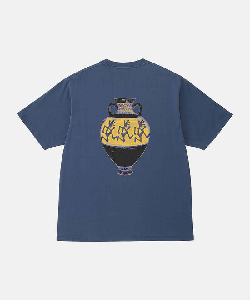 Back view of a Gramicci navy Vase Tee with a graphic against a light-tone background.