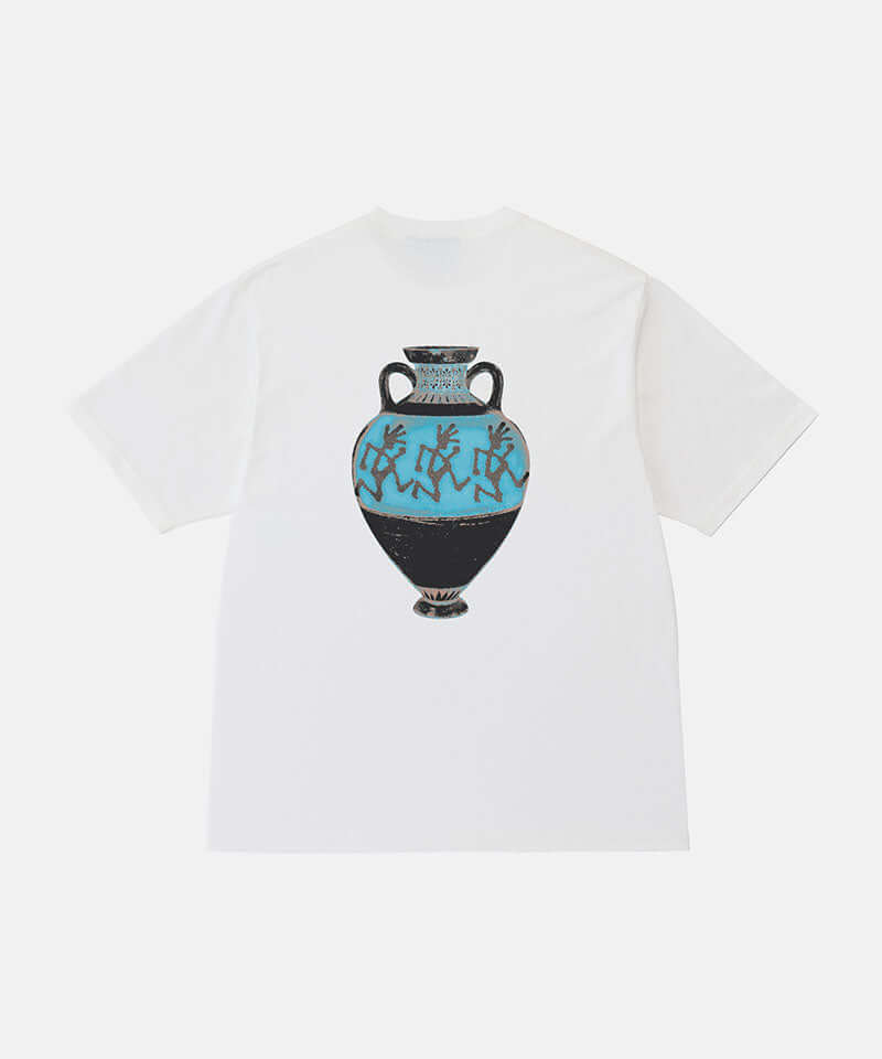 Back view of a Gramicci white Vase Tee with a graphic against a light-tone background.