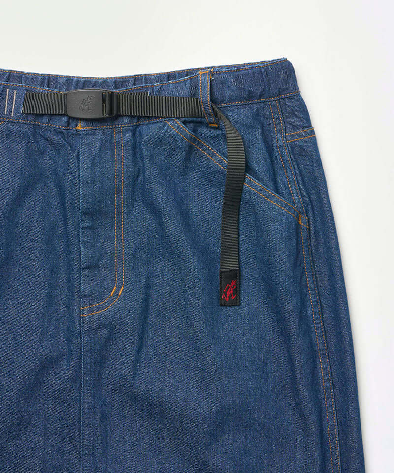 Close-up view of a stone colored Gramicci Denim Carpenter Skirt against a light-tone background.
