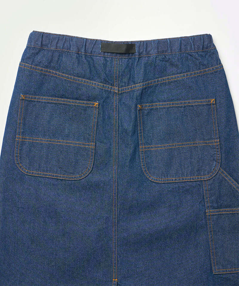 Back view close-up of a stone colored Gramicci Denim Carpenter Skirt against a light-tone background.