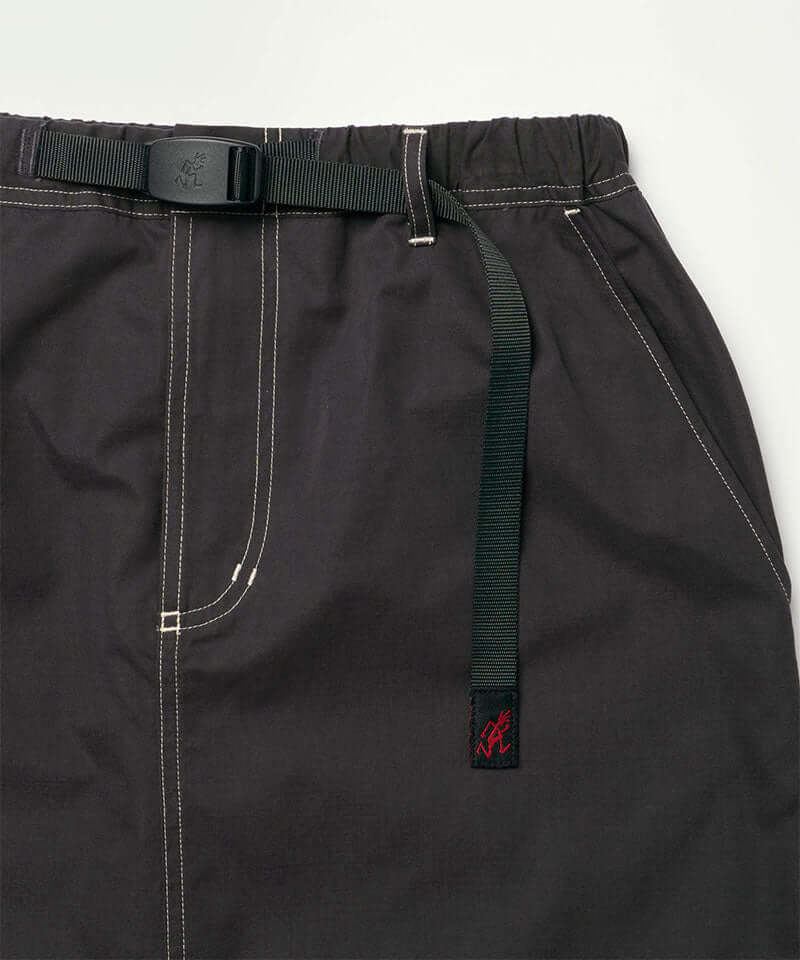 Close-up view of a black women's Gramicci WR Convertible Skirt against a light-tone background.