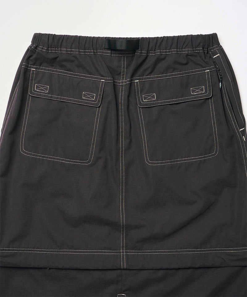 Back view close-up of a black women's Gramicci WR Convertible Skirt against a light-tone background.