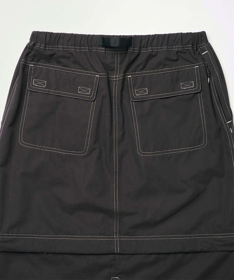 Back view close-up of a black women's Gramicci WR Convertible Skirt against a light-tone background.