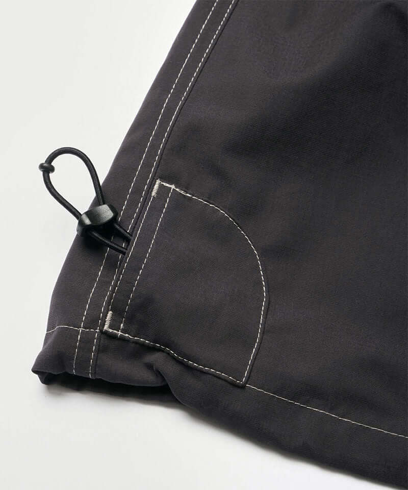 Black women's Gramicci WR Convertible Skirt hem showing a drawstring on a light-tone background.