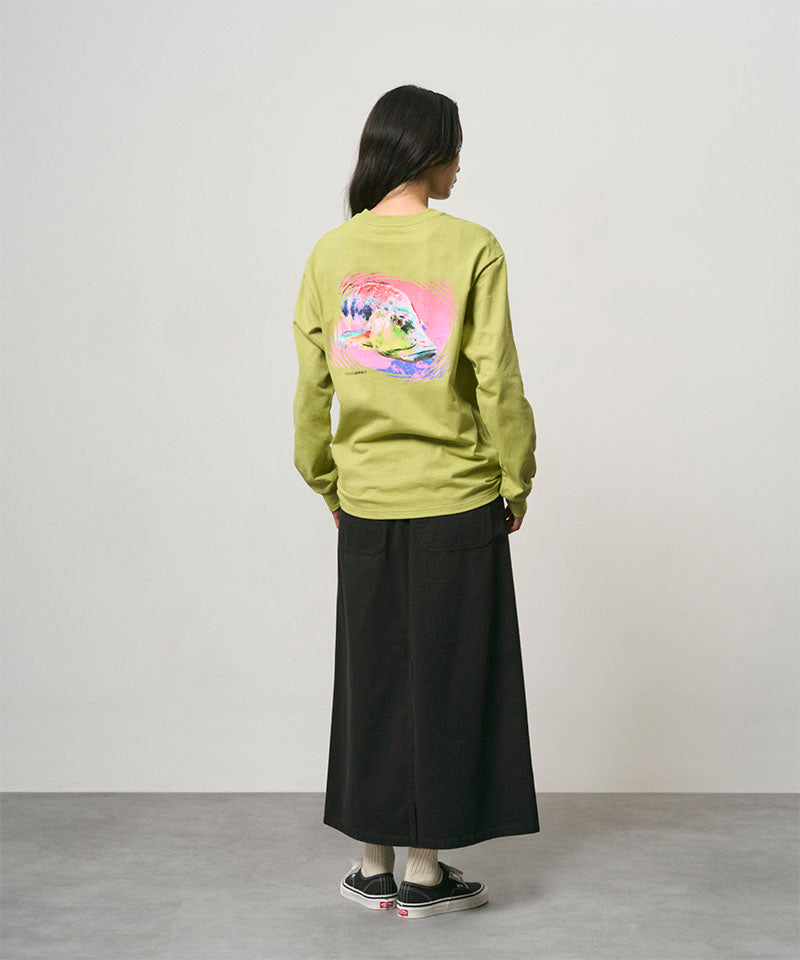 Back view of a model wearing a black Gramicci 5-Pocket Skirt and a lime green shirt on a light-tone background.