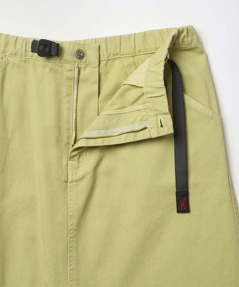 Close-up of the waistband on a elm pigment colored Gramicci Gramicci 5-Pocket Skirt on a light-tone background.