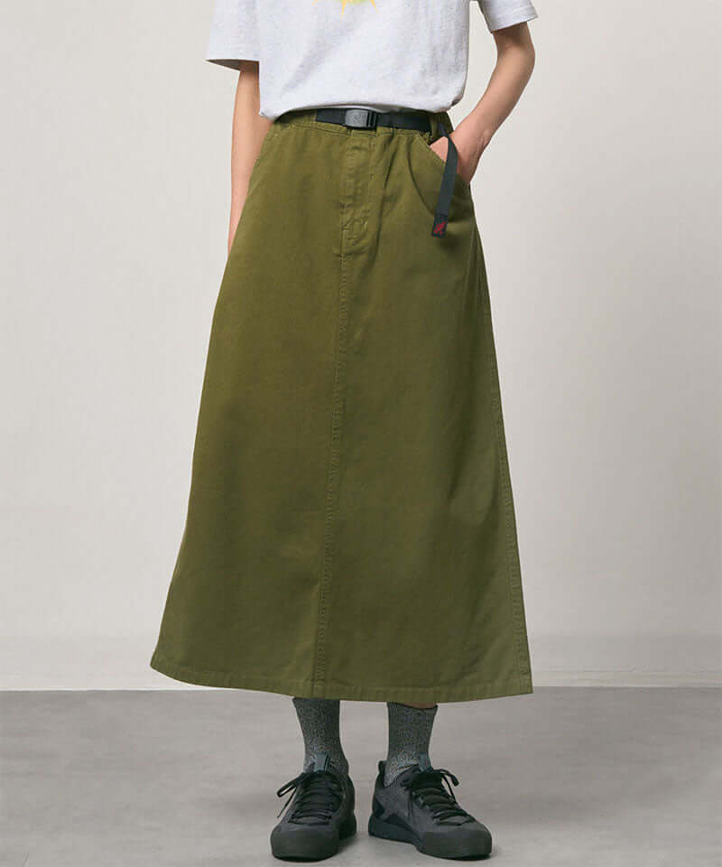 Olive colored Gramicci 5-Pocket Skirt against a light-tone background.