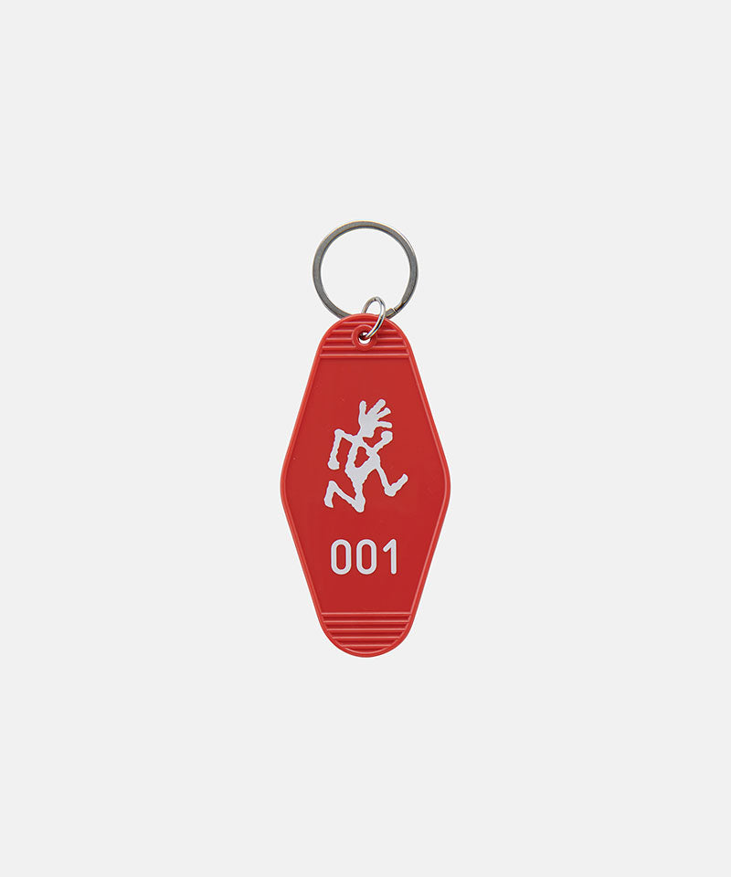 Red Gramicci Hotel Keychain against a light-tone background.