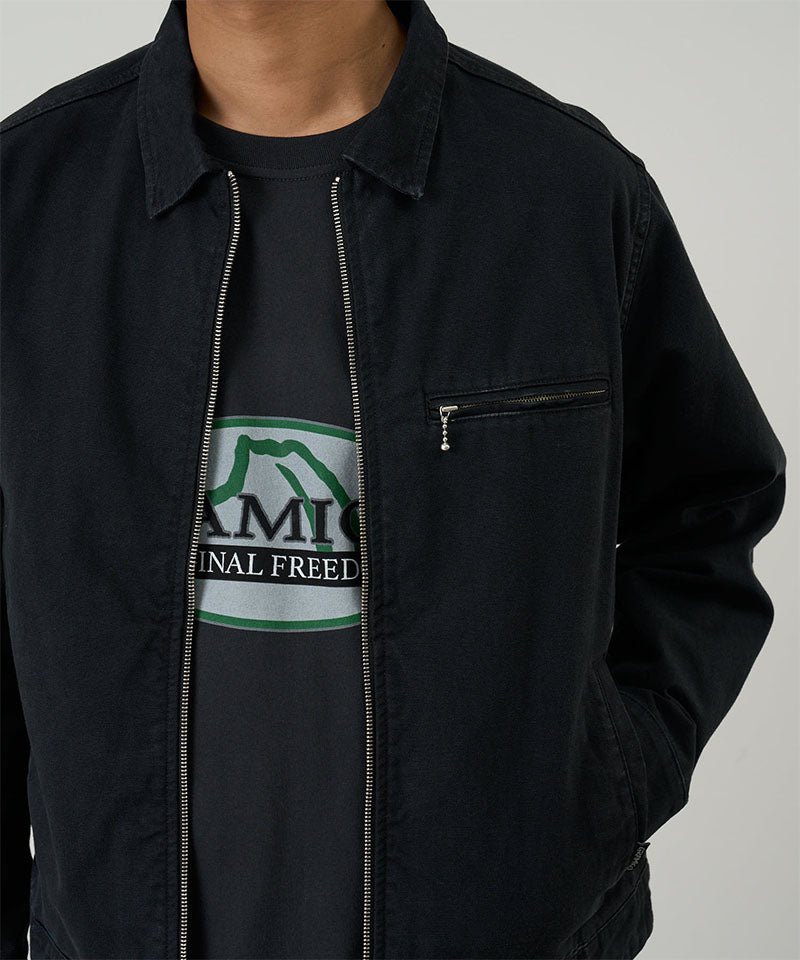 Model wearing a Gramicci black Taos Canvas Jacket against a light-tone background.