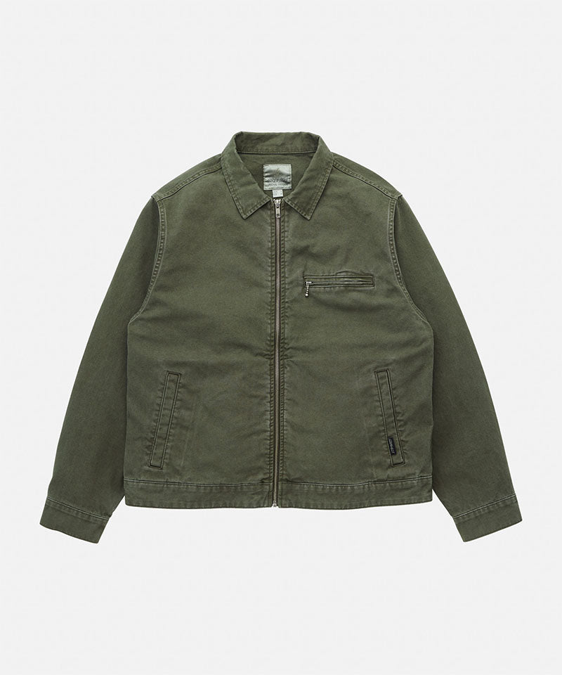Gramicci moss green Taos Canvas Jacket against a light-tone background.