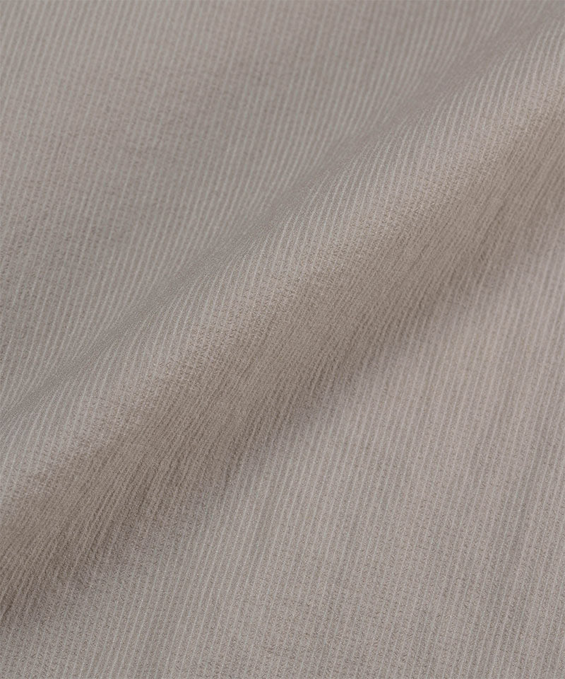 Gramicci concrete colored Ultra-Light Packable Jacket fabric swatch.