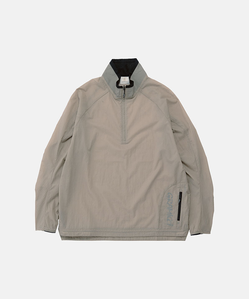 Gramicci concrete colored Ultra-Light Packable Jacket against a light-tone background.