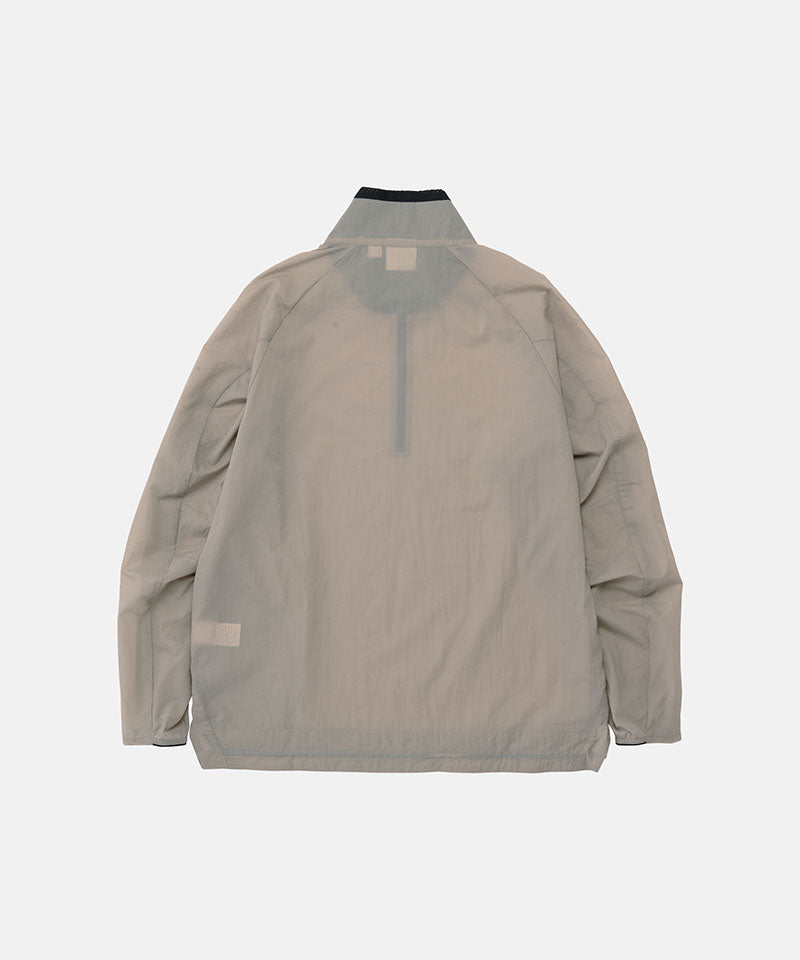 Back view of a Gramicci concrete colored Ultra-Light Packable Jacket against a light-tone background.