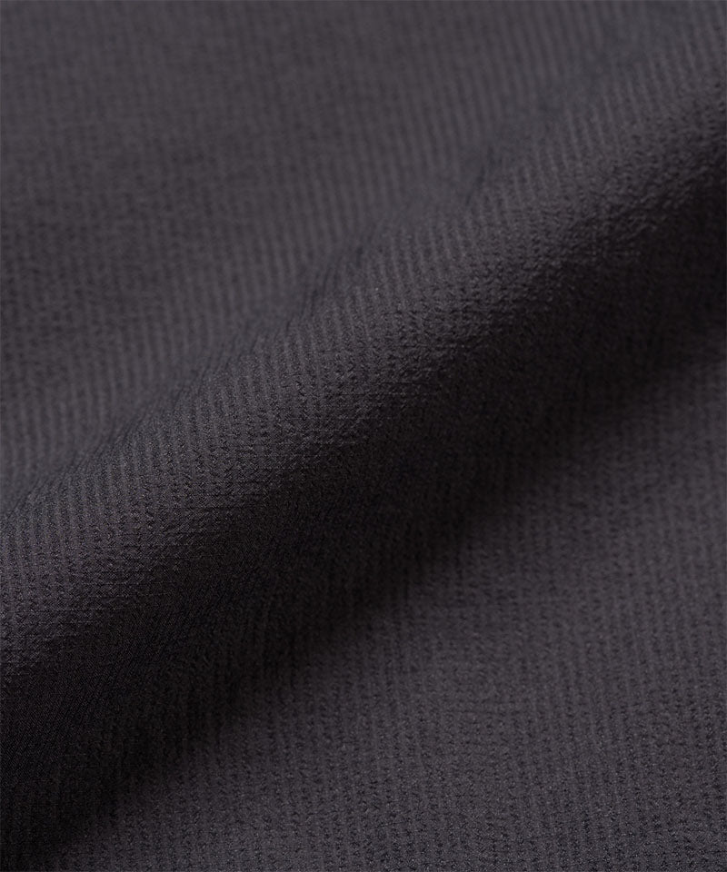 Gramicci midnight colored Ultra-Light Packable Jacket fabric swatch.