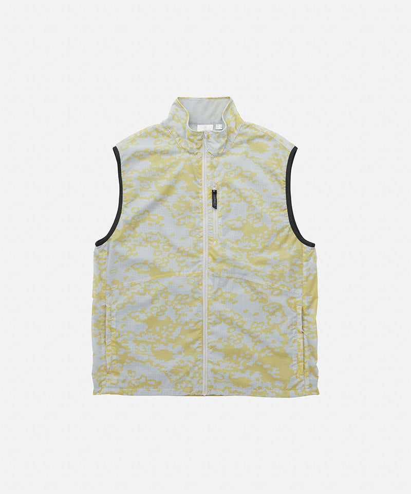 Yellow and white patterned vest on a light gray background