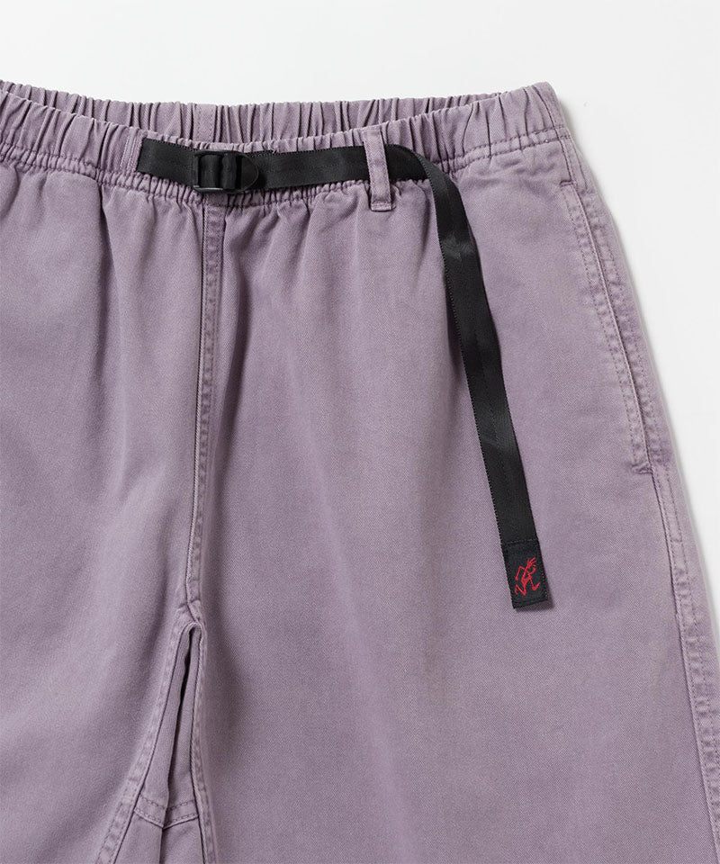 Close-up of Gramicci Natural Dyed Jam Short in the color purple with a black belt against a light-tone background.