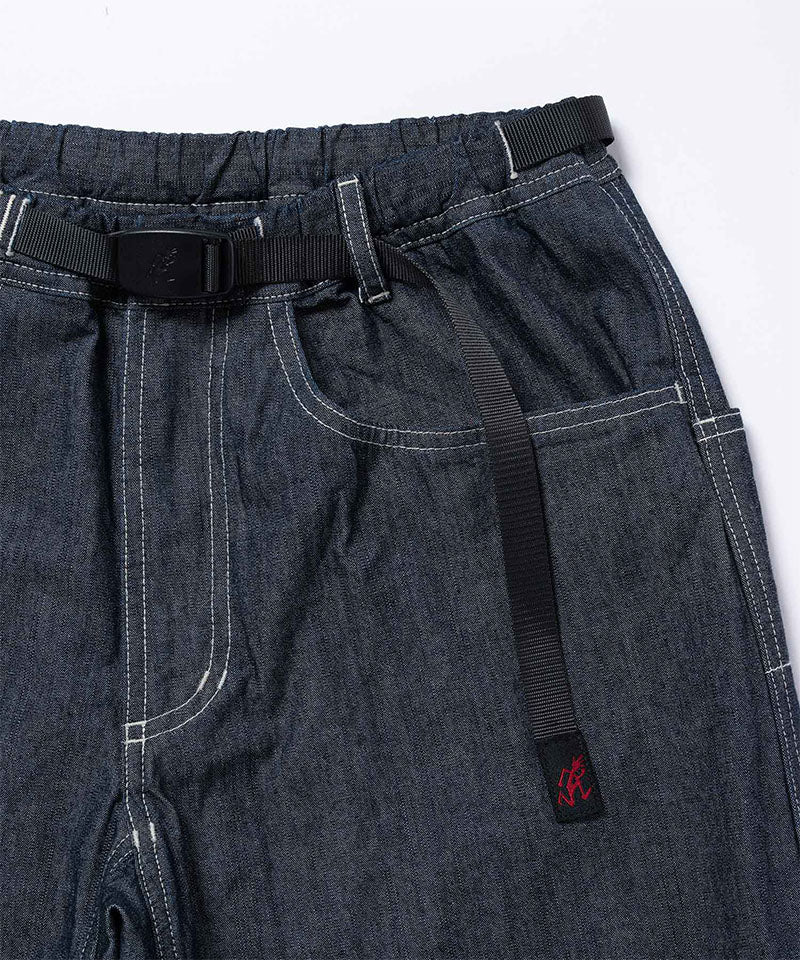 Close-up of Japanese Chambray Rock Slide Pants in the color navy against a light-tone background.
