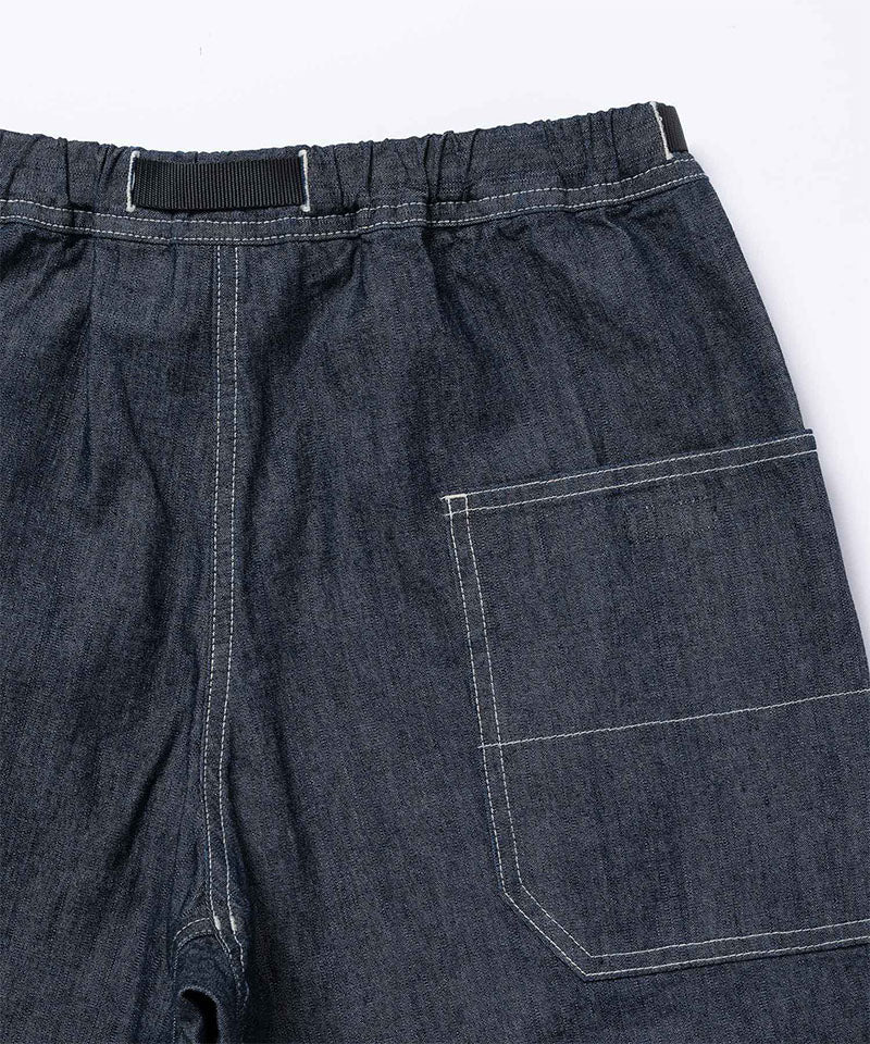 Back view close-up of Japanese Chambray Rock Slide Pants in the color navy against a light-tone background.