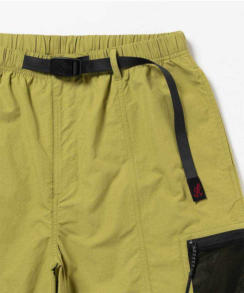 Green shorts with a black belt and zipper pocket on a white background