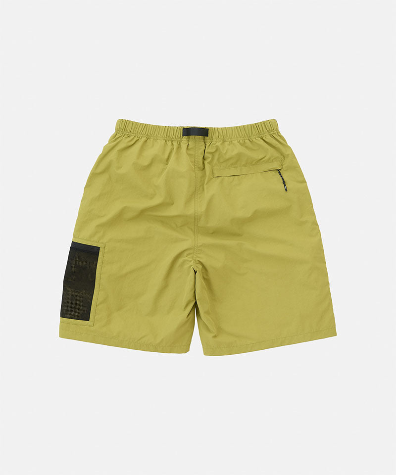 Green shorts with a black patch on a white background