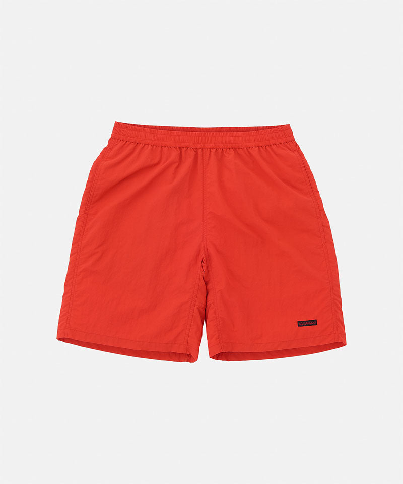 Red shorts on a light gray background