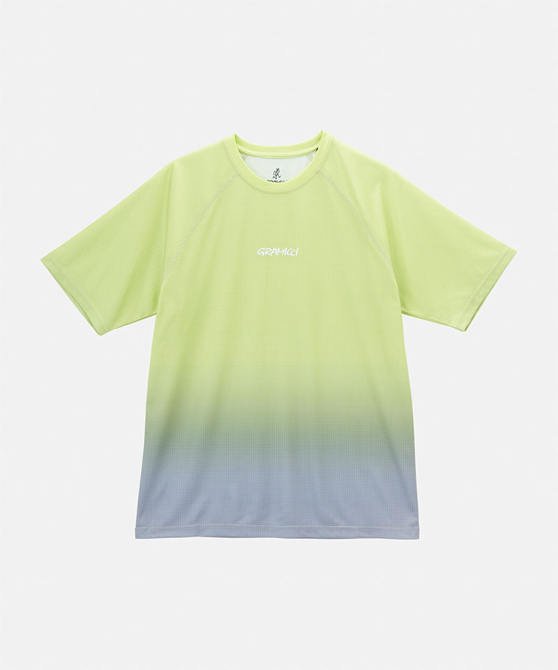 Gramicci yellow gradient UPF Shield S/S Top with a white Gramicci graphic against a light-tone background.