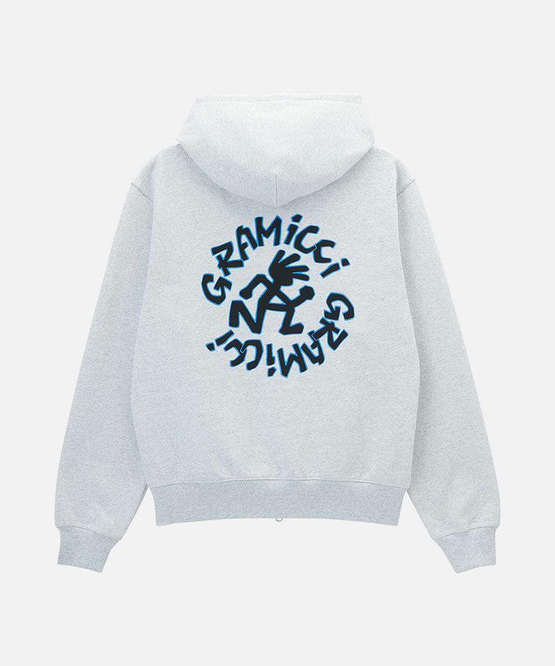 Back view of a heather ash Gramicci Running Man Zip Hooded Sweatshirt with a running man graphic against a light-tone background.