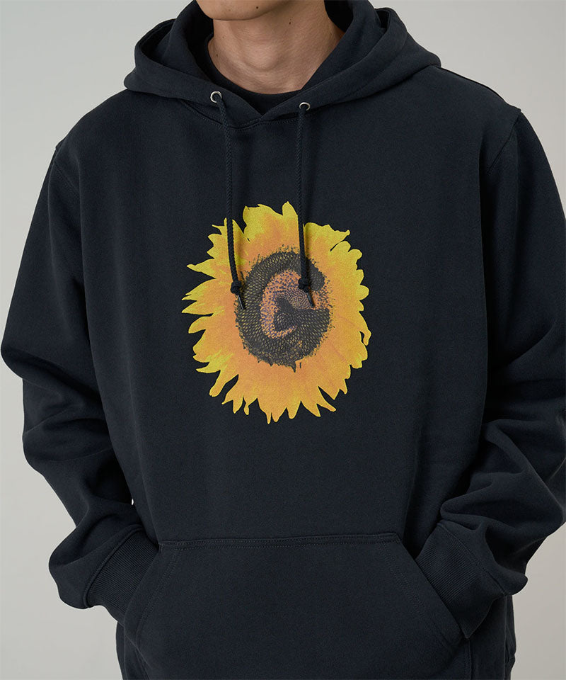 Black hoodie with a sunflower design on a gray background
