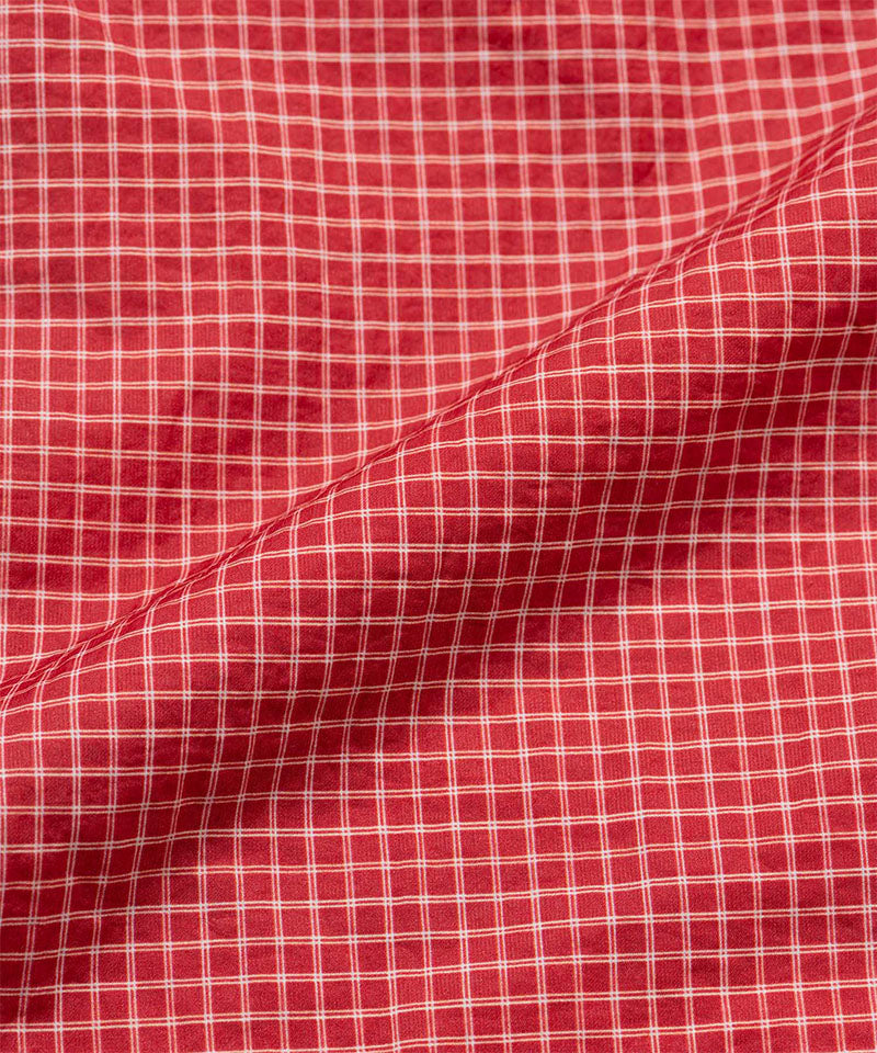 Close-up of red checkered fabric with a visible pattern