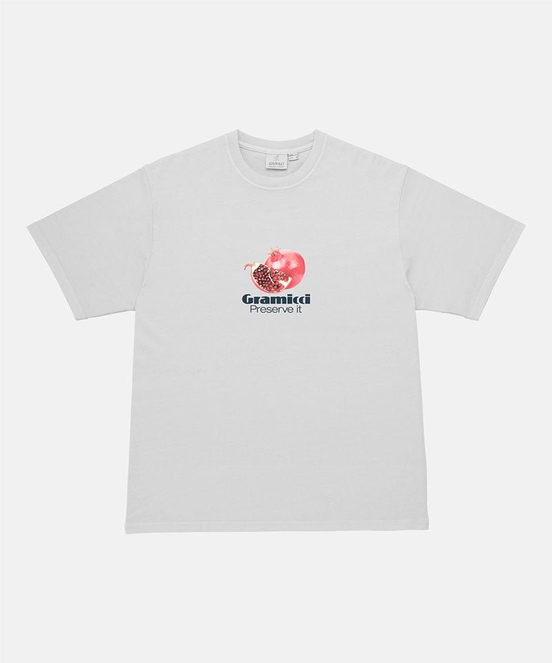 Gramicci white Pomegranate Tee with a graphic against a light-tone background.