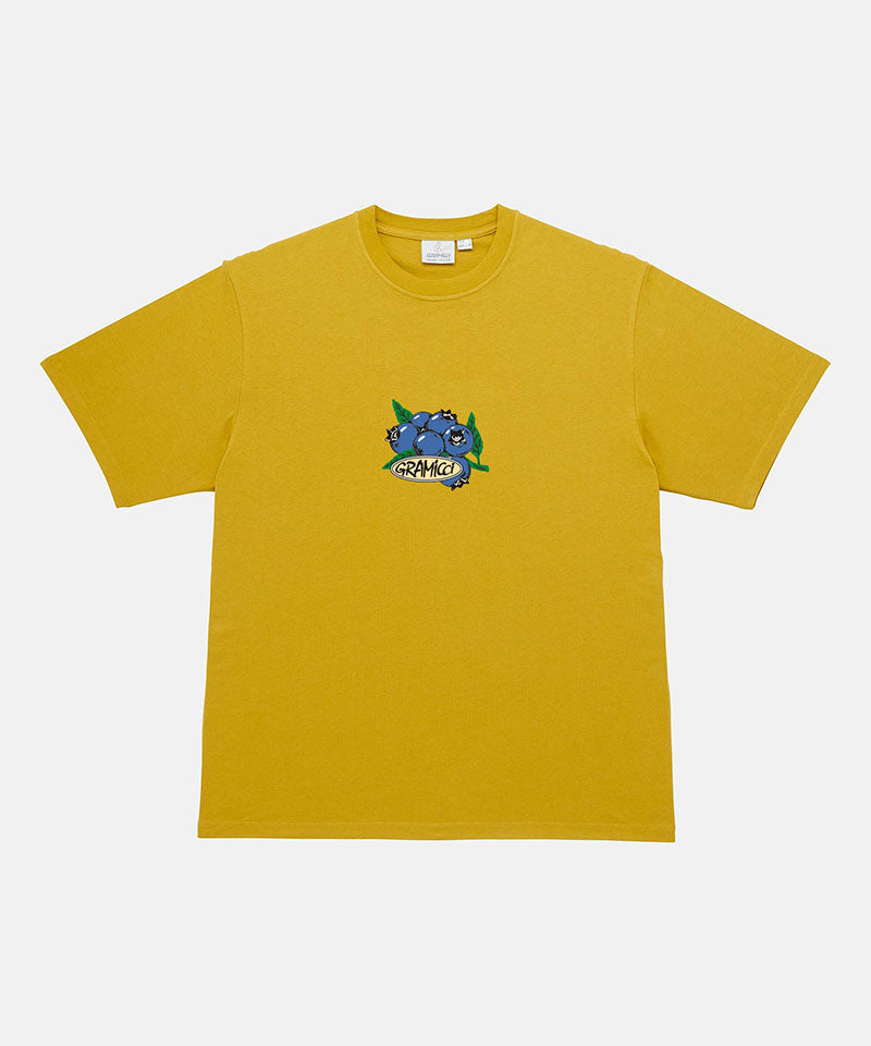 Gramicci Blueberry Tee featuring a blueberry graphic in yellow against a light tone background.