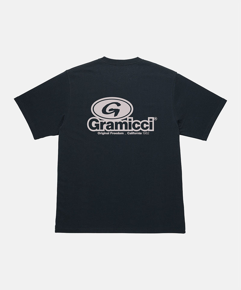 Back view of a Gramicci vintage black '82 Tee with beige graphic against a light tone background.