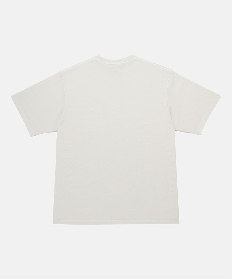 Back view of a Gramicci natural pigment Freedom Tee Pigment Dyed against a light tone background.