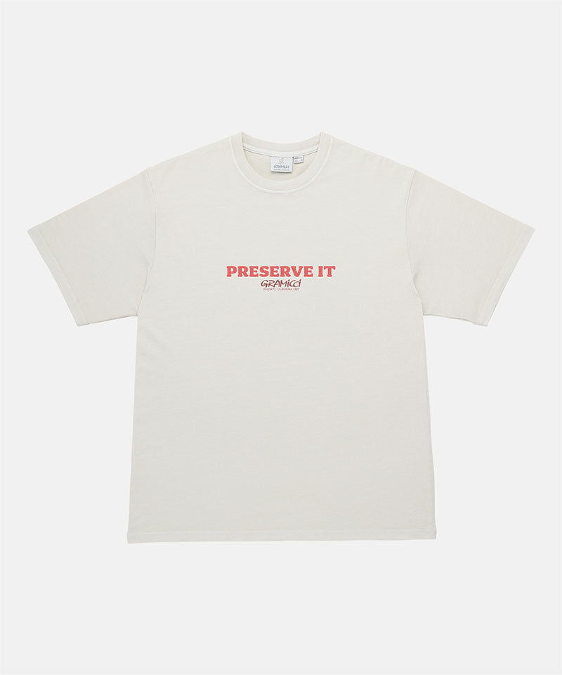 Gramicci natural pigment Footprints Tee Pigment Dyed with red preserve it graphic against a light tone background.