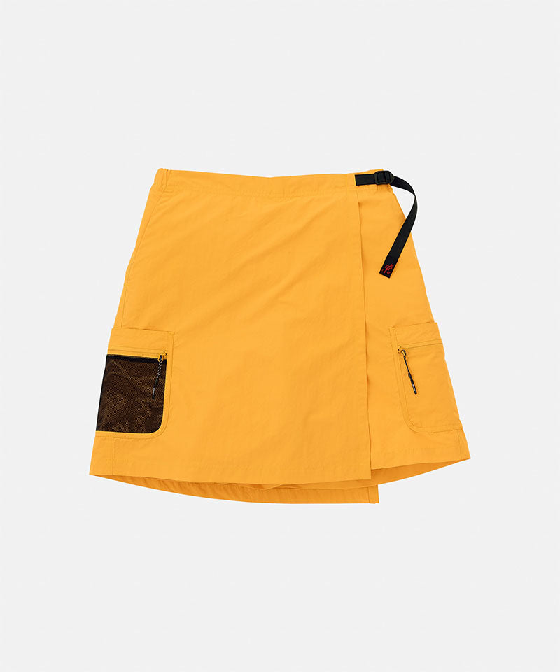 Gramicci Guide Skort in mango colored with a black belt against a light-tone background.