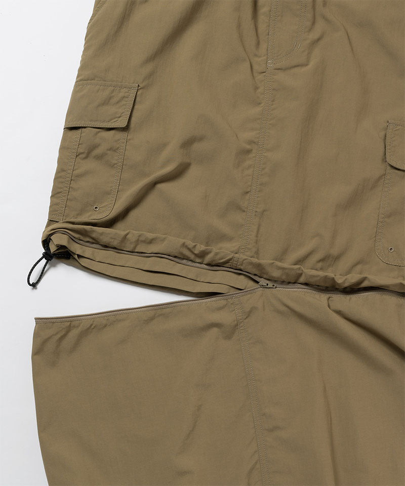 Close-up of Gramicci Convertible Cargo Skirt in the color khaki against a light-tone background.