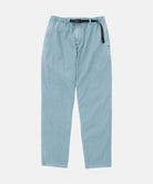 Dusty blue pigment Gramicci Pants with a belt against a light-tone background.
