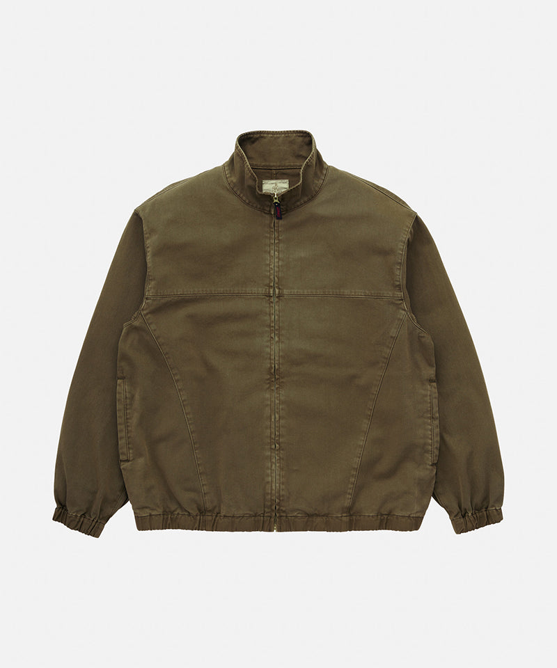Gramicci bark pigment colored Twill-Around Jacket against a light-tone background.