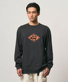 Model wearing a Gramicci vintage black Flames Long Sleeve Tee with a graphic against a light-tone background.