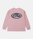 Back view of a Gramicci lilac pigment GCE Long Sleeve Tee Pigment Dyed with a graphic against a light-tone background.